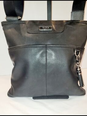 Tumi Black Leather Crossbody with Tassel Charm